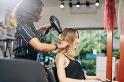 Young woman having her hair blowdried 459252